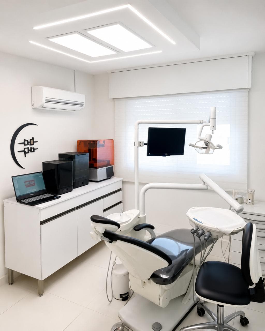 Bright treatment room with 3D printers and a dental chair
